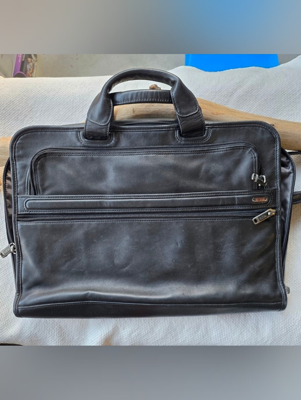 Tumi black leather briefcase